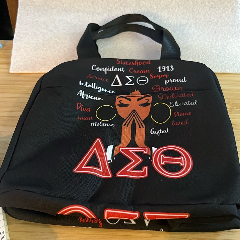 Emolus Delta Theta sorority paraphernalia bag.